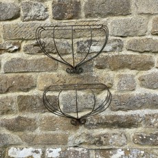 Handcrafted pair of wrought iron baskets